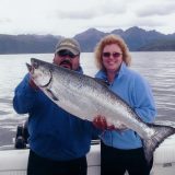 Lisa Montgomery and friend, holding their caught fish up for demonstration purposes