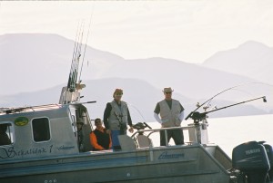 Three men on a fishing boat at Kodiak Sportsman's Lodge in Alaska